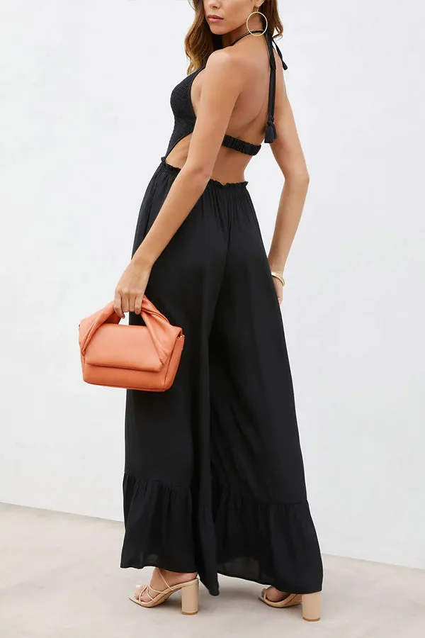 Solid color halter neck open back flared jumpsuit